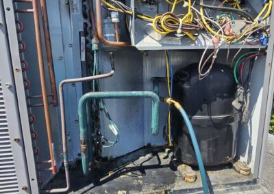 Outdoor AC condenser opened for coil and pressure inspection in Kings Point, Delray Beach