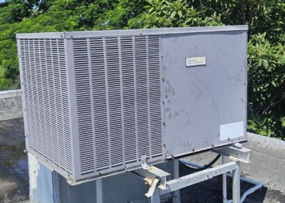 Rooftop AC condenser on a stand at a Kings Point condo in Delray Beach