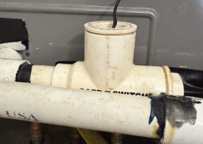 Condensate drain tee and float safety switch on an air handler in Boynton Beach