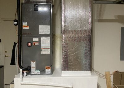New garage air handler with a sealed and insulated supply plenum in Westchester Country Club, Boynton Beach