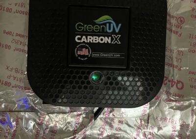 GreenUV Carbon-X air purifier mounted on a foil-faced supply plenum in Wellington