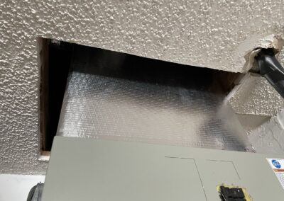 New supply plenum and duct transition above an air handler in a Wellington home