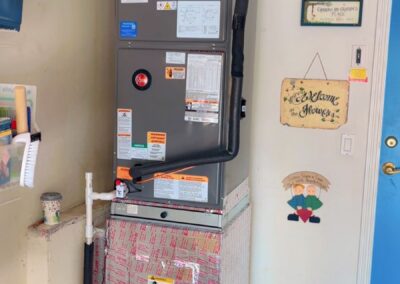 New air handler in a closet with a GreenUV Carbon-X air purifier on the supply plenum in Valencia Shores, Wellington