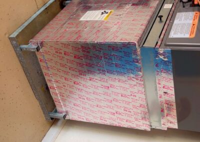 Sealed and wrapped base and plenum of a newly installed air handler in Valencia Shores, Wellington
