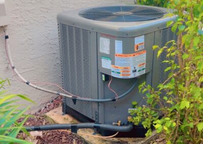 New outdoor AC condenser on its pad after a system replacement in Valencia Shores, Wellington