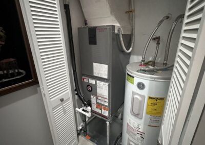 New air handler installed in a utility closet beside the water heater in The Bridges, Delray Beach