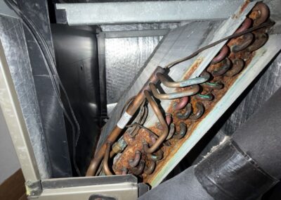 Evaporator coil and refrigerant lines inside an air handler in Canyon Trails, Boynton Beach