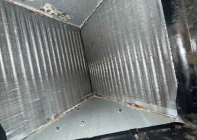 Insulated supply plenum interior inspected during AC maintenance in Boynton Beach