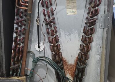Evaporator coil and copper refrigerant lines inspected during an AC tune-up in Boynton Beach