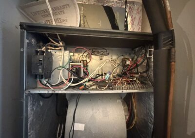 Air handler control compartment and blower open for cleaning during a tune-up in West Palm Beach