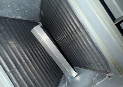 Inside an air handler cabinet after cleaning during AC maintenance in West Palm Beach