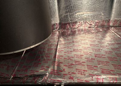 New foil-faced insulated liner installed around the blower inside an air handler in West Palm Beach