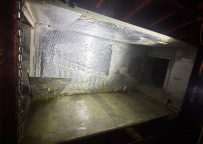 Attic air handler cabinet opened for re-insulation in a West Palm Beach home