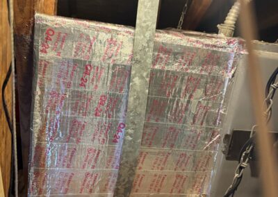 New foil-sealed insulated plenum built around a suspended attic air handler in Floral Park, Lake Worth