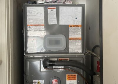 Carbon-X whole-house UV air purifier mounted on the supply plenum above a new air handler in Boynton Beach