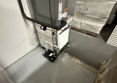 New upright air handler with a condensate safety switch installed in a warehouse building in the Lake Worth area