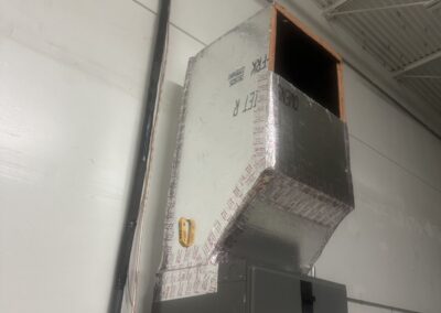 New sheet-metal supply plenum on an air handler in a warehouse building in the Lake Worth area
