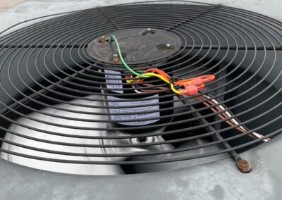 New condenser fan motor installed on a rooftop condenser on a commercial building in Lantana