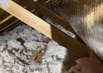 Flex duct run above blown-in insulation in an attic in Canyon Trails, Boynton Beach