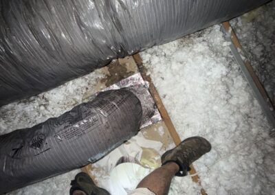Insulated flex duct runs over blown-in attic insulation in Boynton Beach