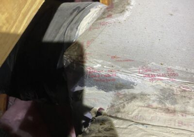 Stained and broken facing on an attic duct-board trunk where flex ducts connect in Valencia Cove, Boynton Beach