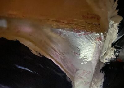 Repaired duct-board box with sealed seams and a flex duct connection in an attic in Valencia Cove, Boynton Beach