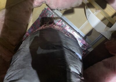 Flex duct reconnected and foil-sealed at a ceiling box in a Boynton Beach attic