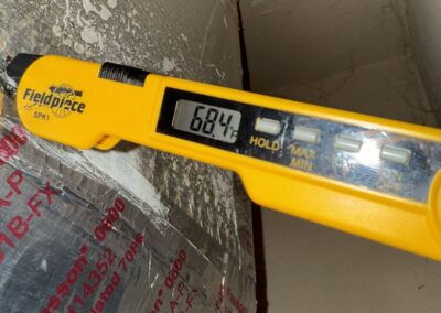 Digital thermometer reading supply air temperature at an air handler in Briella, Boynton Beach