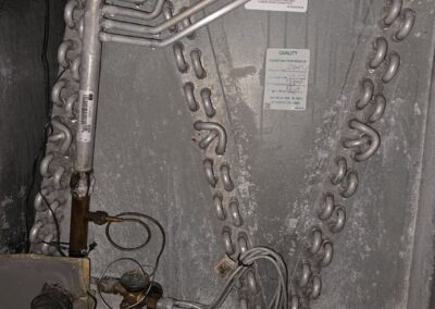 Evaporator coil and refrigerant lines inside an air handler in Canyon Trails, Boynton Beach