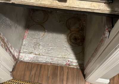 Air handler closet floor with PVC drain line and no secondary drain pan in an Indian Springs condo