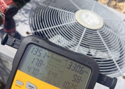 Refrigerant manifold gauge readings taken at the outdoor AC unit after a UV light install in Boynton Beach